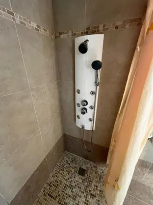 a shower with a shower head in a bathroom at Casa Romeo in Brion