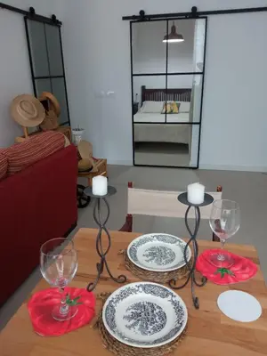 a table with plates and glasses on top of it at OLI VITA HOLIDAY HOME 4 O 2 PEOPLE Viveiro VUT-LU-3838 in Viveiro