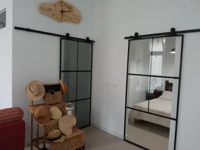 a room with a glass case and a bed at OLI VITA HOLIDAY HOME 4 O 2 PEOPLE Viveiro VUT-LU-3838 in Viveiro