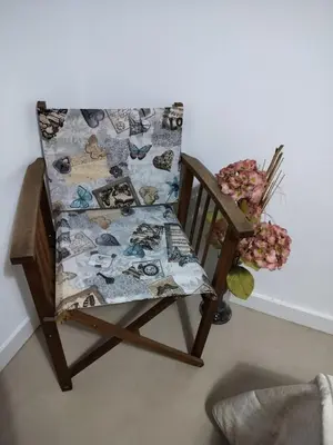 a chair with a quilt on the back of it at OLI VITA HOLIDAY HOME 4 O 2 PEOPLE Viveiro VUT-LU-3838 in Viveiro