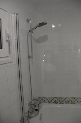 a shower with a glass door in a bathroom at Tras Do Atrio Casa en el Centro de Betanzos in Betanzos
