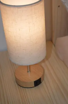 a lamp sitting on top of a wooden table at Tras Do Atrio Casa en el Centro de Betanzos in Betanzos