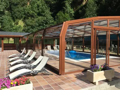 a group of lounge chairs next to a swimming pool at Tixileiro in Sisterna