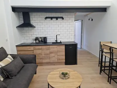 a living room with a couch and a table at Apartamentos Pasiño in Portomarin