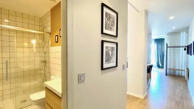 a bathroom with a shower and a sink and a toilet at The Cliffs A Ribeira - Pampillosa in Foz