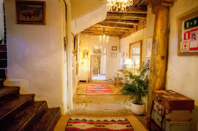 a hallway of a house with a table and a plant at Arzipreste I Casa del Cura in León