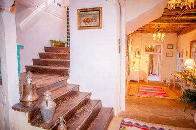 a stairway in a home with wooden steps at Arzipreste I Casa del Cura in León