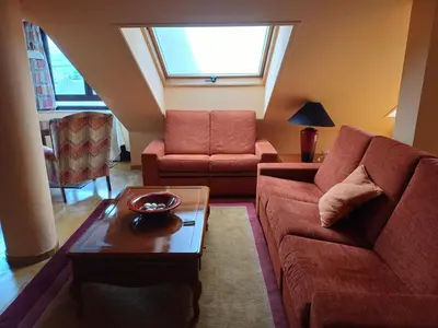 a living room with a couch and a table at La Tebaida in Ponferrada