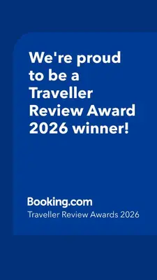 a blue sign that says were proud to be a traveller reviewagency winner at Rest Pedrouzo in O Pedrouzo
