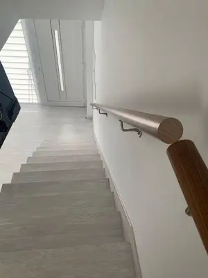 a staircase in a room with a stair railing at Amencer en Llas in Foz