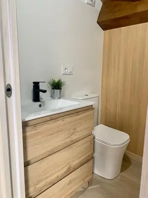 a bathroom with a sink and a toilet at Amencer en Llas in Foz