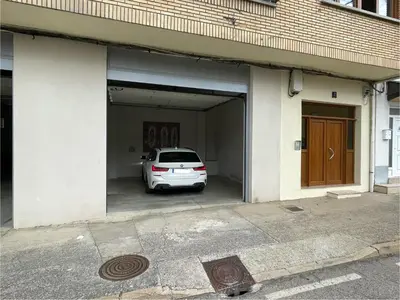 a white car is parked in a garage at Los Balcones de Vega in Vega de Espinareda