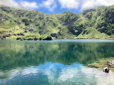 a view of a lake with mountains in the background at Somiedoeco in Caunedo