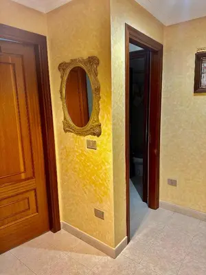 a room with a mirror on the wall and a door at Hostal La Cubana in Carballino