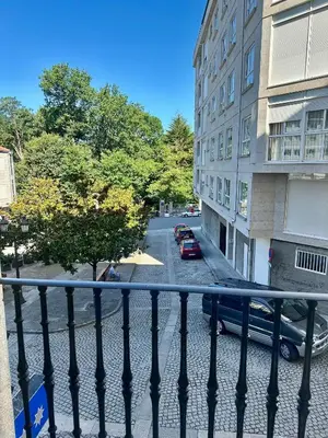 a view of a street from a balcony of a building at Hostal La Cubana in Carballino
