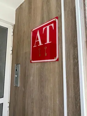 a sign on the side of a door with an air sign at Apartamentos Torres del Milladoiro in Amés