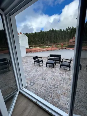 a view of benches from a window at Apartamentos Torres del Milladoiro in Amés