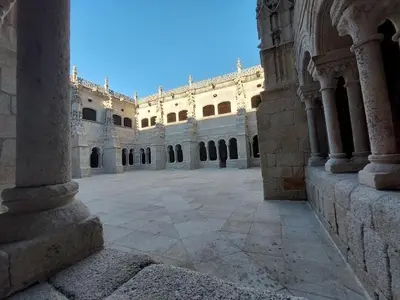 an empty courtyard of a large building with columns at O Recuncho da Isa - Ribeira Sacra in Pereiro de Aguiar