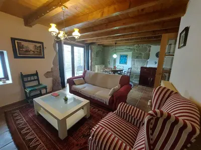 a living room with a couch and a coffee table at O Recuncho da Isa - Ribeira Sacra in Pereiro de Aguiar