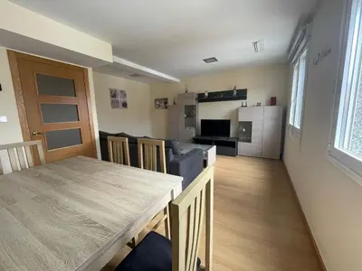 a kitchen and living room with a table and a dining room at YourHouse Maca I in Ourense