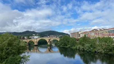 a bridge over a river in a city at YourHouse Maca I in Ourense