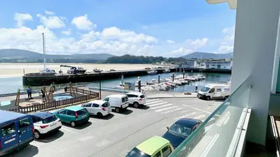 a bunch of cars parked in a parking lot at The Cliffs A Ribeira - Llas in Foz