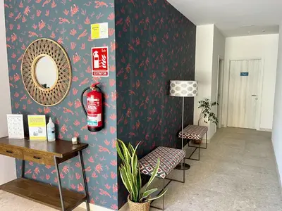 a room with a mirror and two chairs and a table at The Cliffs A Ribeira - Llas in Foz