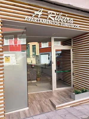 a restaurant with a sign on the front of the door at The Cliffs A Ribeira - Peizas in Foz