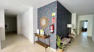 a living room with a wall with a fire extinguisher at The Cliffs A Ribeira - Peizas in Foz