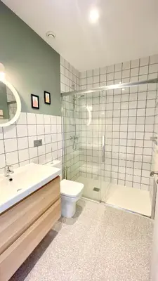 a bathroom with a sink and a toilet and a shower at The Cliffs A Ribeira - Peizas in Foz