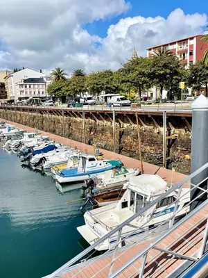 a group of boats docked in a marina at The Cliffs A Ribeira - Peizas in Foz