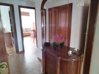 a living room with a room with a large mirror at A Ribeira in Fene