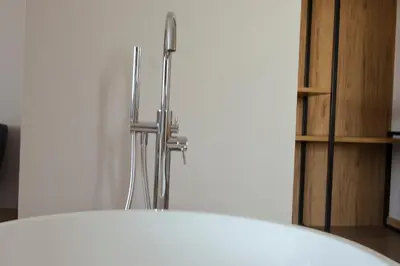 a white refrigerator in a room with a shelf at La Finca in Lugo