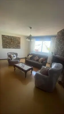a living room with couches and a coffee table at As pontes apartamento in Puentes de García Rodríguez