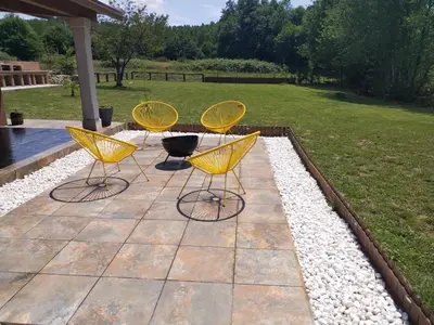 three yellow chairs sitting on top of a patio at Apartamentos Muralla Sacra in Sober