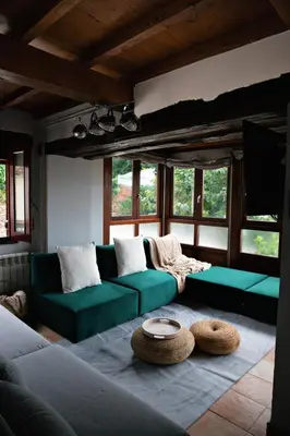 a living room with a green couch and a table at Casa Trillo en centro de Monforte de Lemos in Monforte de Lemos