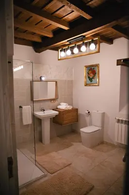 a bathroom with a toilet and a sink at Casa Trillo en centro de Monforte de Lemos in Monforte de Lemos