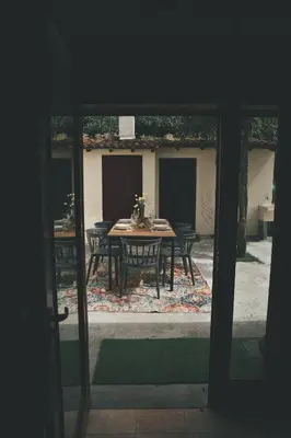 a table and chairs in a yard with a patio at Casa Trillo en centro de Monforte de Lemos in Monforte de Lemos