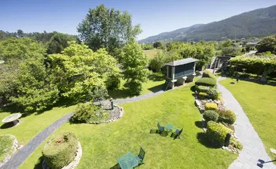 an aerial view of a garden with a building at Pazo da Trave in Viveiro