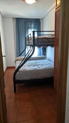 a bedroom with two bunk beds and a window at Refugio de mar in Barreiros