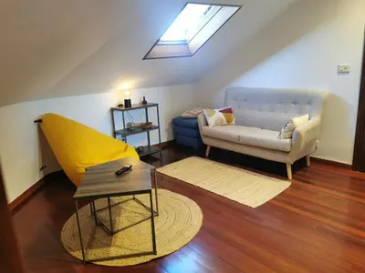 a living room with a couch and a table at Apartamento entero Frama Caldas in Caldas de Reis