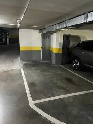 a parking garage with a car parked in it at Bierzo Explore in Ponferrada