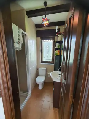 a small bathroom with a toilet and a sink at EnSan CIPRIAN Casa Lula in Cervo