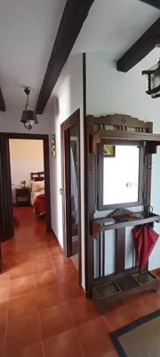 a living room with a flat screen tv on a wall at EnSan CIPRIAN Casa Lula in Cervo