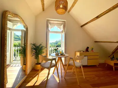 a living room with a table and a mirror at Villa Boutique 1880 -Romantic Historic Villa & Private Outdoor Spa- Adults Only in A Lama