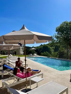 a bedroom with a bed with white towels on it at Villa Boutique 1880 -Romantic Historic Villa & Private Outdoor Spa- Adults Only in A Lama