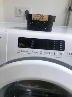 a box on top of a washing machine at Melide Suites By OL in Melide