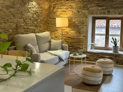 a living room with a couch and a table at Casa Agolada in Golada