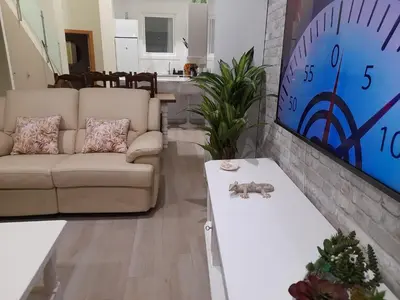 a living room with a couch and a table at La Herencia A VuT 1229 in Ponferrada