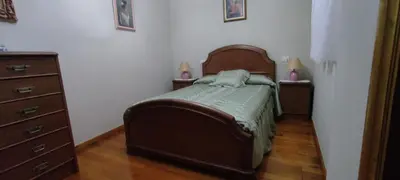 a bedroom with a bed and two nightstands and a bed sidx sidx sidx at Casa SANTALLA in O Barco de Valdeorras